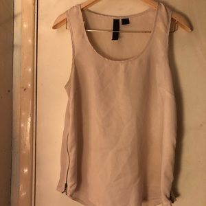Cute very light pink top with zippers on the side